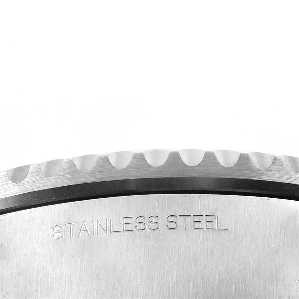This image shows a close-up of the side view of the bezel and case back of a Rolex Sea-Dweller 116660 Men's Stainless Steel Blue Dial 116660 Men's Stainless Steel Blue Dial, highlighting its stainless steel material.