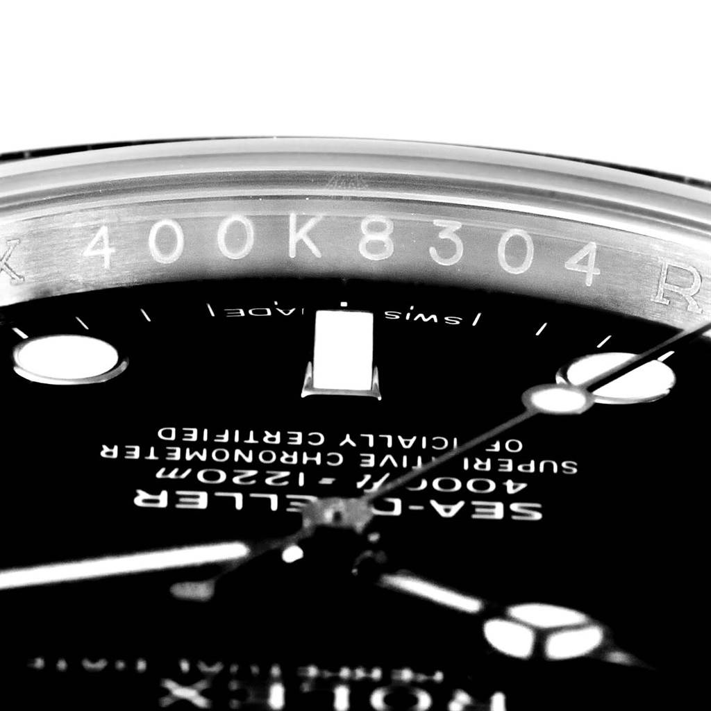 This close-up image shows the dial, hands, and part of the inner bezel with engravings of the Rolex Sea-Dweller 116600 Men's Stainless Steel Black Dial 116600 Men's Stainless Steel Black Dial watch.