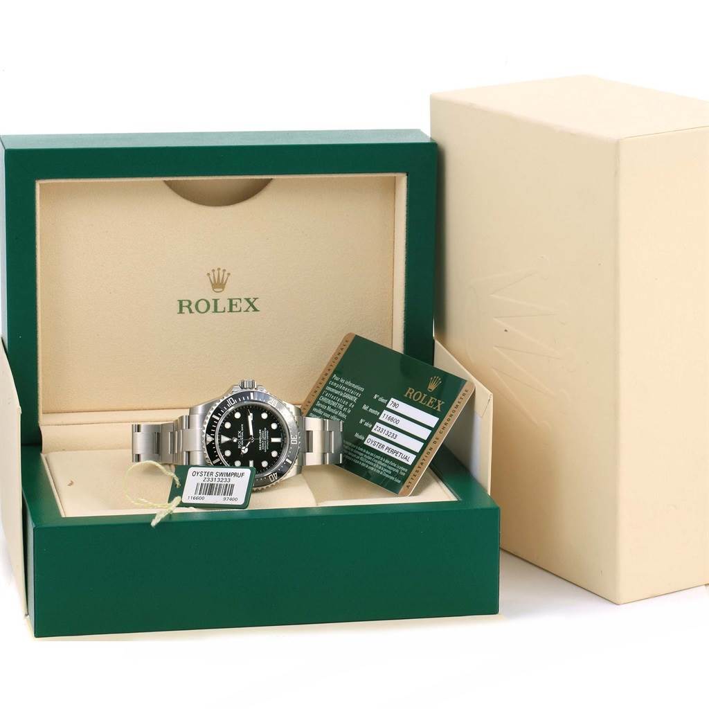 This image shows the Rolex Sea-Dweller 116600 Men's Stainless Steel Black Dial 116600 Men's Stainless Steel Black Dial watch in its box with accompanying warranty card.