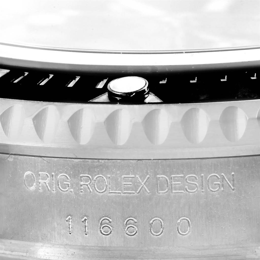 This close-up image of the Rolex Sea-Dweller 116600 Men's Stainless Steel Black Dial 116600 Men's Stainless Steel Black Dial model shows the side case with its model number 116600 and bezel teeth.