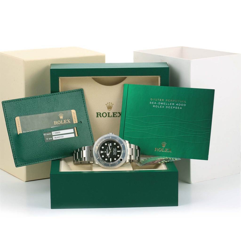 The image shows a Rolex Sea-Dweller 116600 Men's Stainless Steel Black Dial 116600 Men's Stainless Steel Black Dial watch with its box, paperwork, and accessories from a frontal angle.