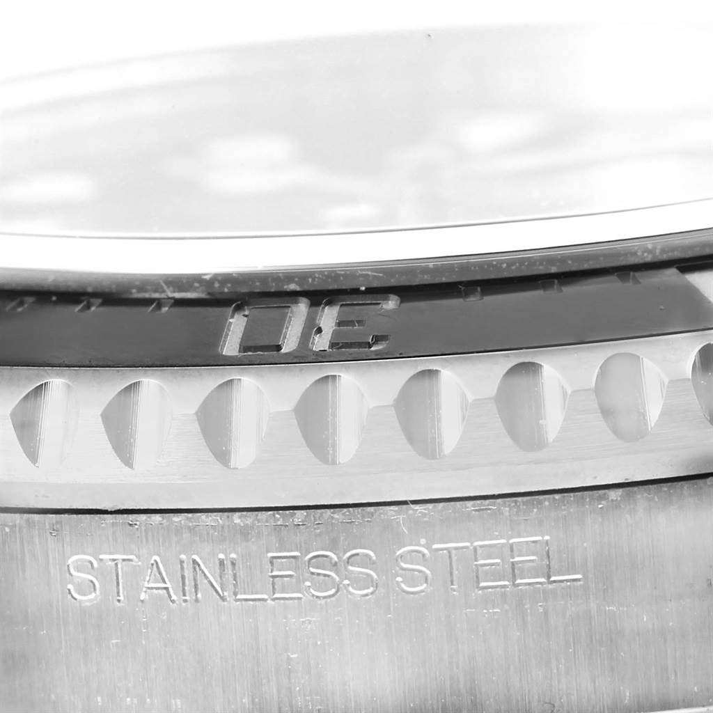 This image shows a detailed macro view of the Rolex Sea-Dweller 116600 Men
s Stainless Steel Black Dial 116600 Men
s Stainless Steel Black Dial watch, focusing on the bezel and stainless steel engraving.