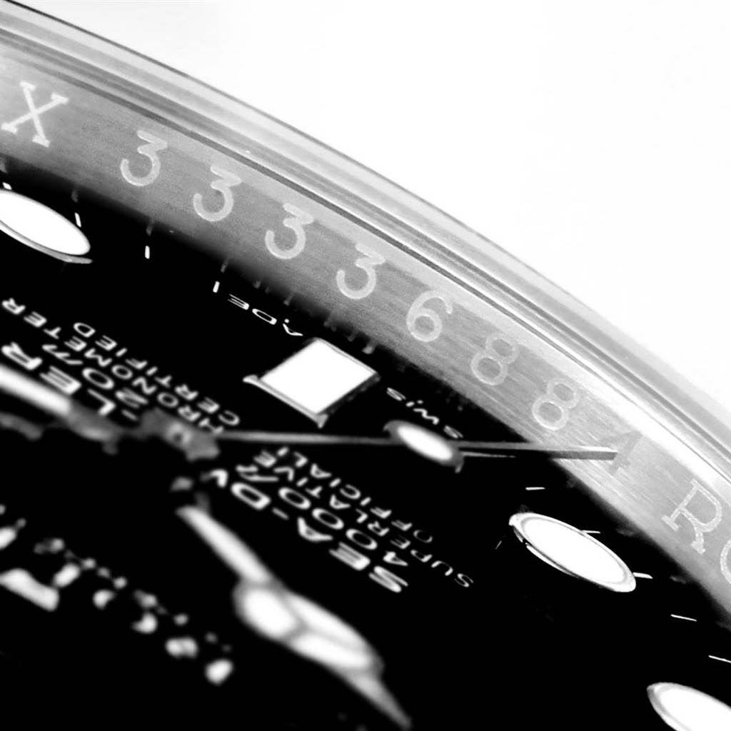 The image shows a close-up, angled view of the dial and bezel of a Rolex Sea-Dweller 116600 Men
s Stainless Steel Black Dial 116600 Men
s Stainless Steel Black Dial watch.