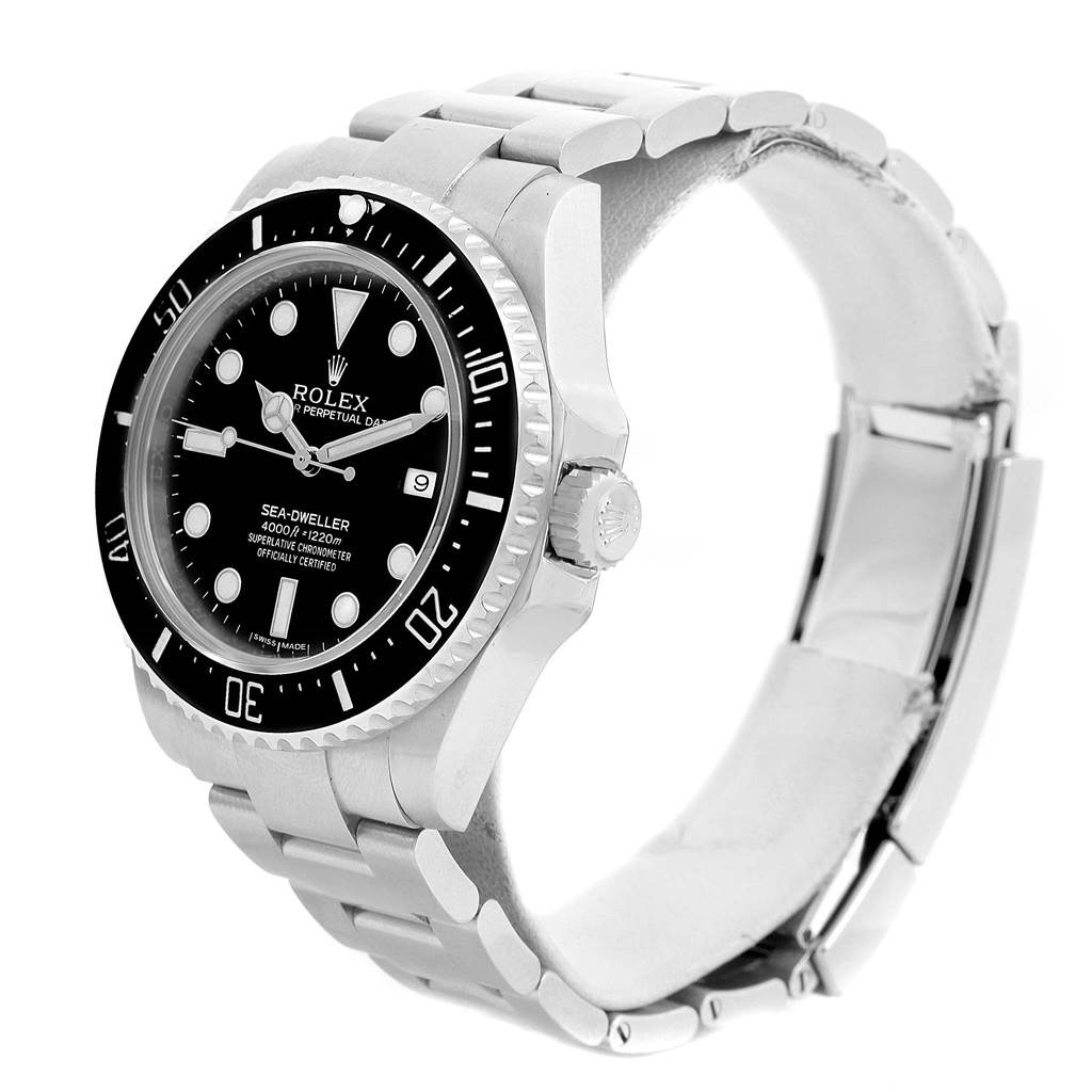 The Rolex Sea-Dweller 116600 Men
s Stainless Steel Black Dial 116600 Men
s Stainless Steel Black Dial watch is shown at an angled side view, displaying the face, bezel, crown, and bracelet.