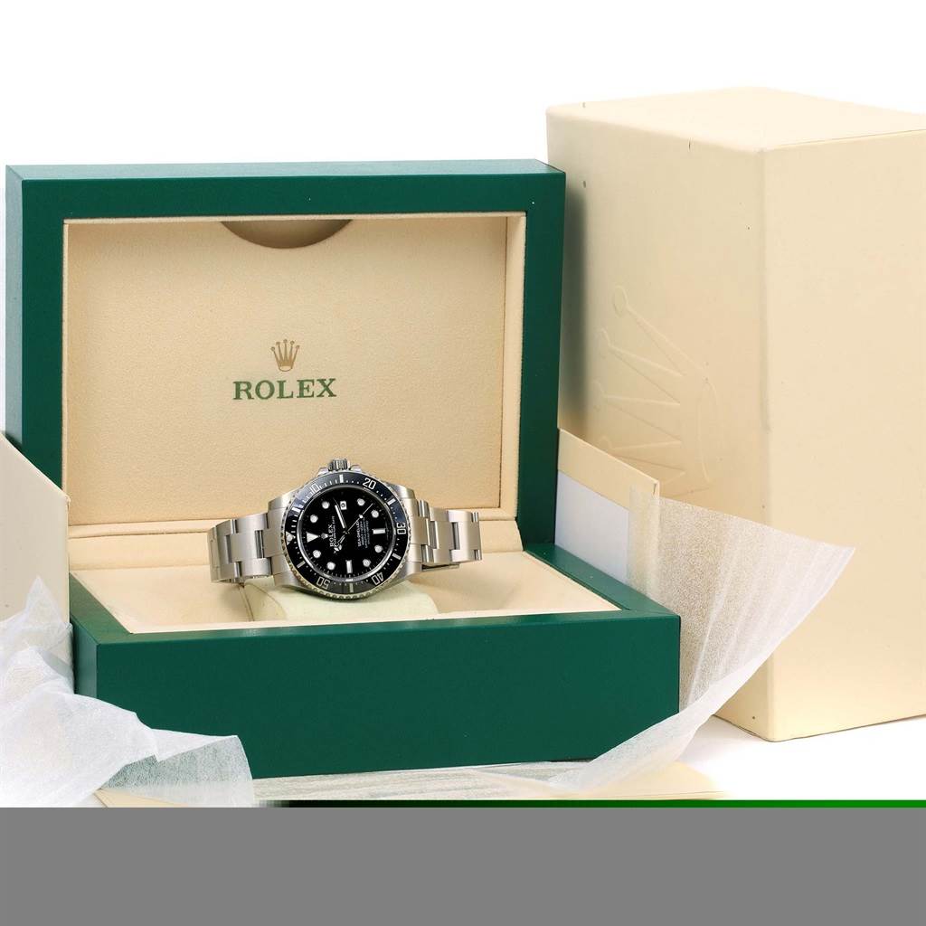 The image shows the Rolex Sea-Dweller 116600 Men
s Stainless Steel Black Dial 116600 Men
s Stainless Steel Black Dial watch in an open green and beige Rolex box, with the watch resting in the center.