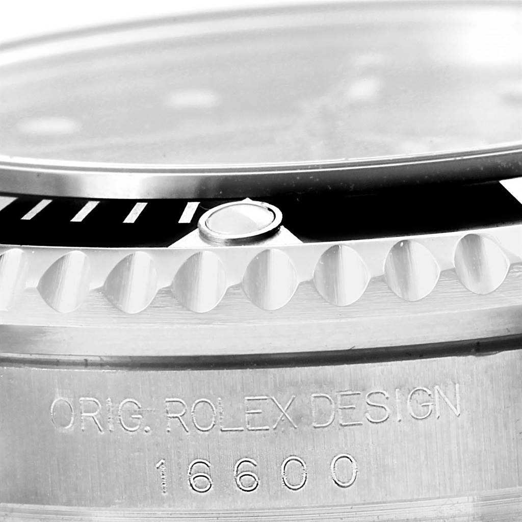 This close-up angle of the Rolex Sea-Dweller 16600 Men's Stainless Steel Black Dial 16600 Men's Stainless Steel Black Dial watch shows the bezel, case edge, and engraved model number.