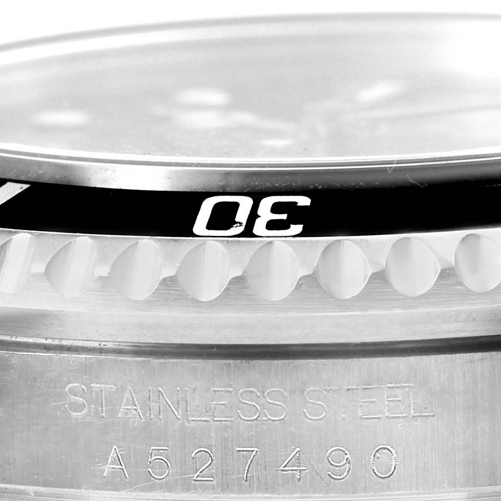 This image shows a close-up of the bezel and part of the case of a Rolex Sea-Dweller 16600 Men's Stainless Steel Black Dial 16600 Men's Stainless Steel Black Dial watch, highlighting the "30" marker and stainless steel inscription.