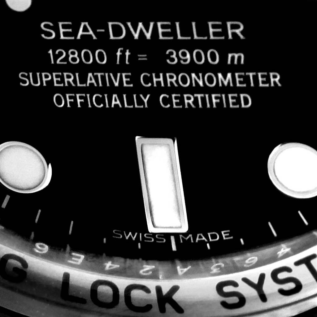 This image shows a close-up of the dial and part of the bezel of a Rolex Sea-Dweller 116660 Men's Stainless Steel Black Dial 116660 Men's Stainless Steel Black Dial watch.