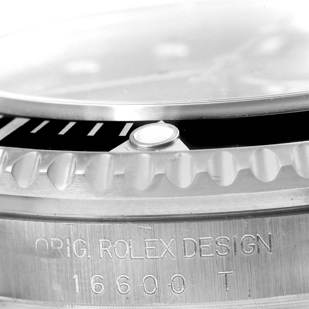 A close-up angle of the Rolex Sea-Dweller 16600 Men
s Stainless Steel Black Dial 16600 Men
s Stainless Steel Black Dial watch showing the bezel, crystal, and engraved model number "16600T".