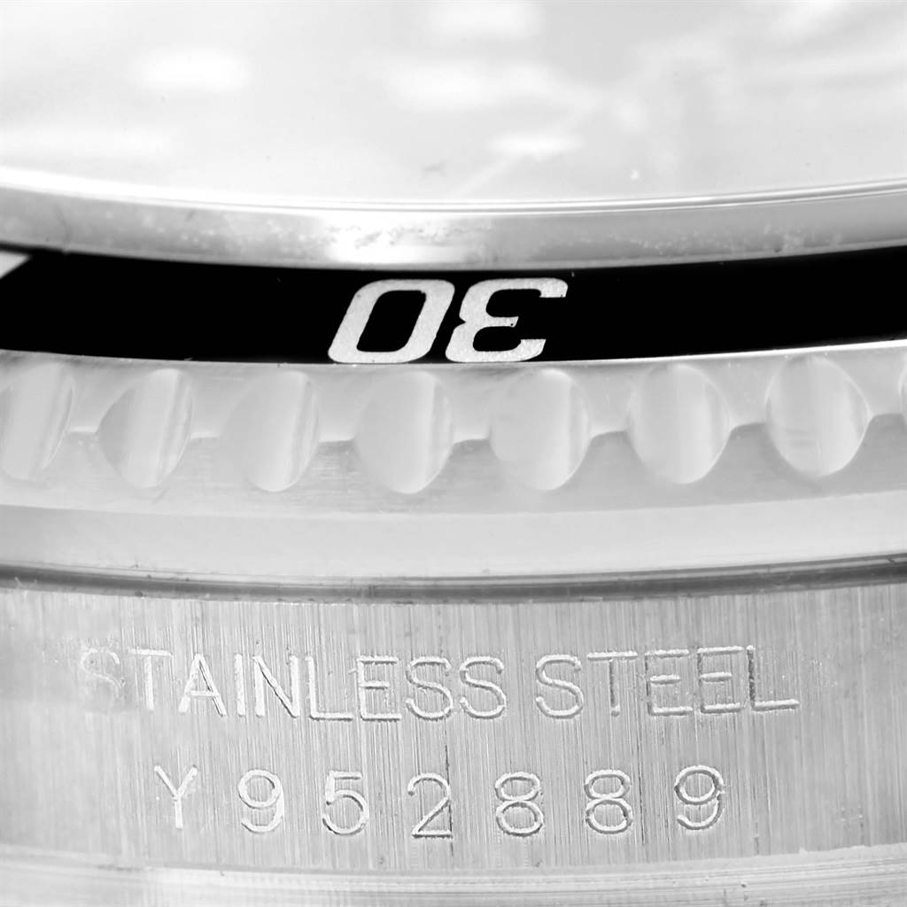 This image shows a close-up of the bezel and serial number on the stainless steel case of a Rolex Sea-Dweller 16600 Men
s Stainless Steel Black Dial 16600 Men
s Stainless Steel Black Dial watch.