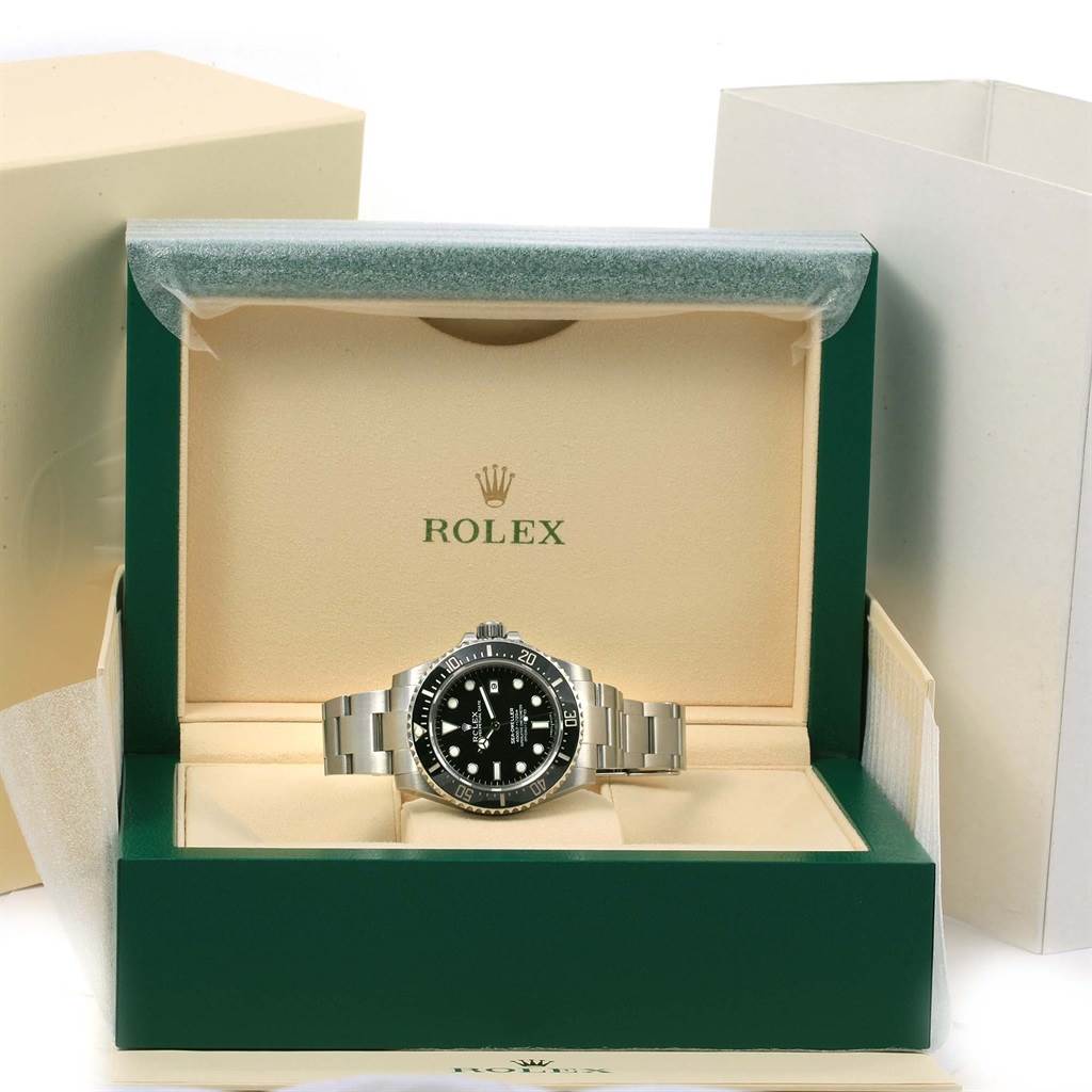 The Rolex Sea-Dweller 116600 Men's Stainless Steel Black Dial 116600 Men's Stainless Steel Black Dial watch is shown front-facing in its open green box with the brand logo visible.