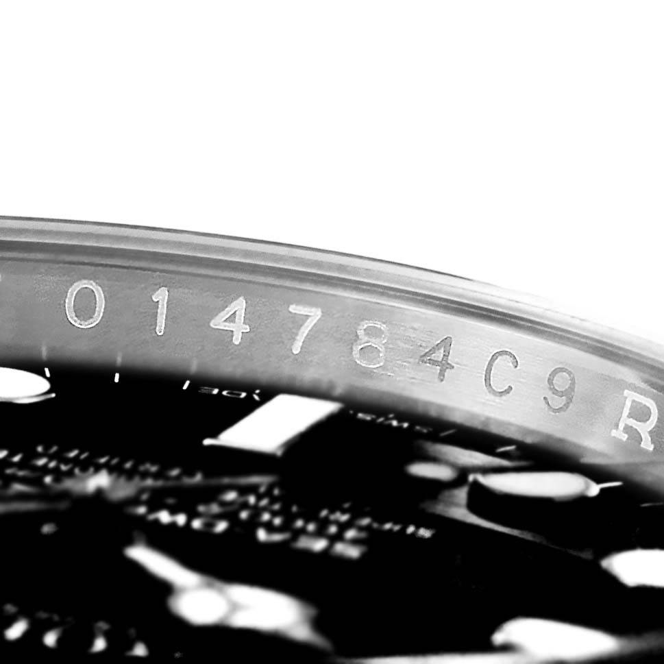 The image shows a close-up of the serial number on the outer rim of the Rolex Sea-Dweller 116600 Men's Stainless Steel Black Dial 116600 Men's Stainless Steel Black Dial watch.