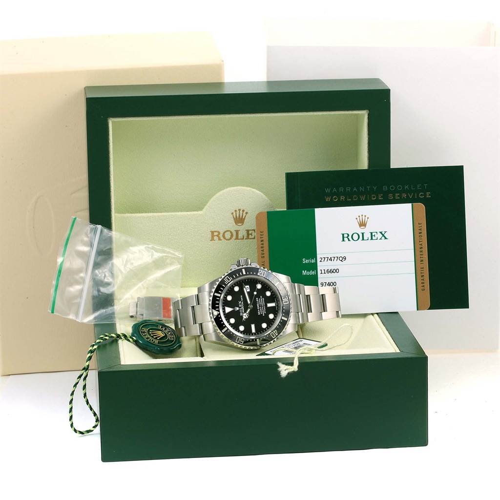 The image shows a Rolex Sea-Dweller 116600 Men
s Stainless Steel Black Dial 116600 Men
s Stainless Steel Black Dial watch in its open box alongside a warranty booklet and Best Quality
ation card.