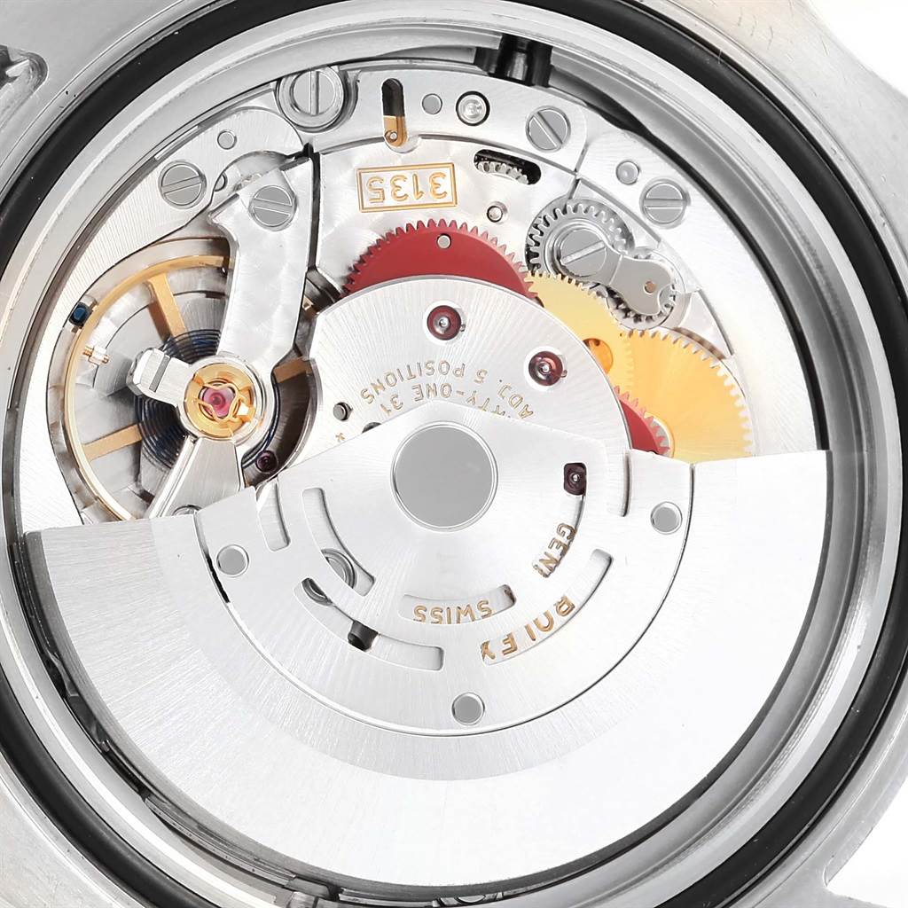 This image shows a close-up view of the internal movement and mechanics of a Rolex Sea-Dweller 116600 Men
s Stainless Steel Black Dial 116600 Men
s Stainless Steel Black Dial watch from the back.