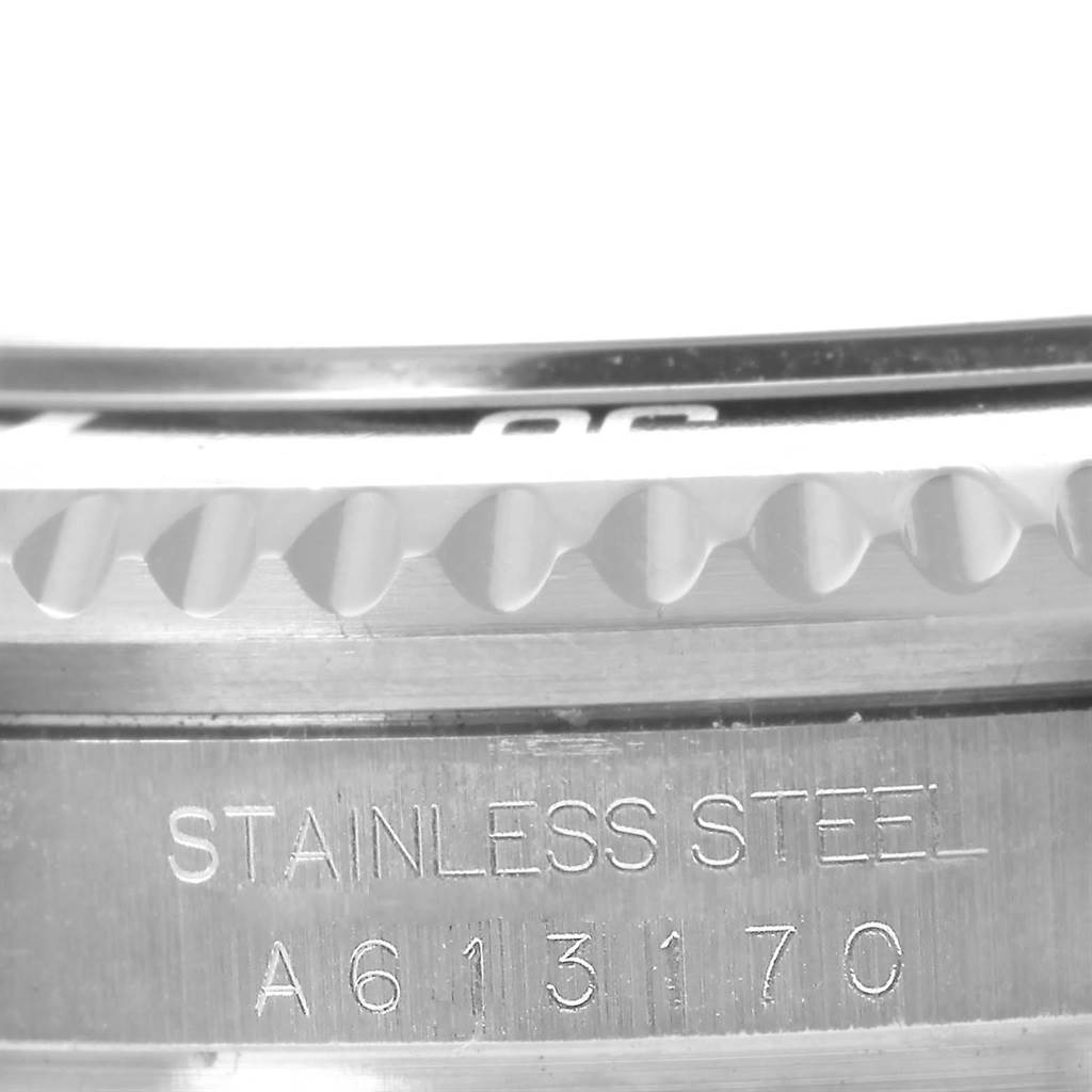 This image shows a close-up of the bezel and the engraved back case of the Rolex Sea-Dweller 16600 Men
s Stainless Steel Black Dial 16600 Men
s Stainless Steel Black Dial, highlighting the stainless steel material and serial number.