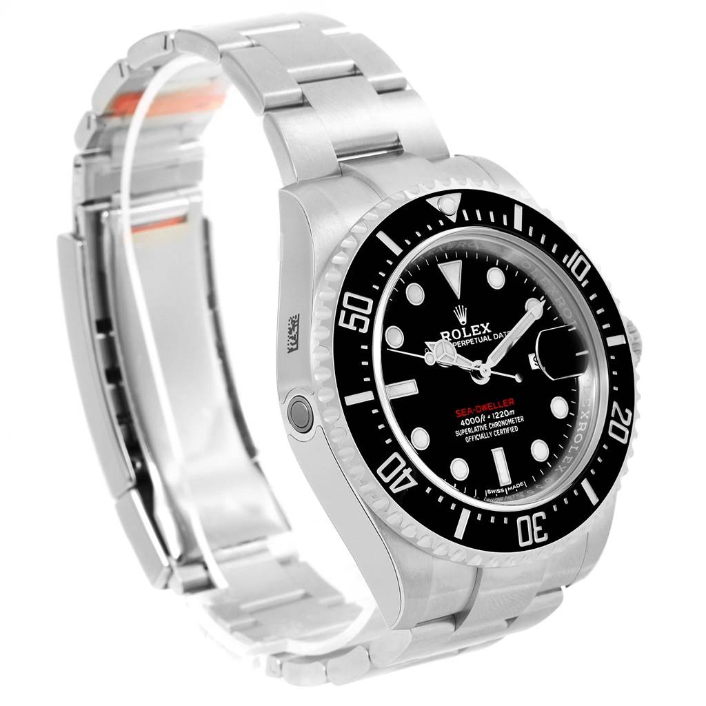 The image shows a Rolex Sea-Dweller 126600 Men
s Stainless Steel Black Dial 126600 Men
s Stainless Steel Black Dial watch at an angled side view, highlighting the face, bezel, crown, and bracelet.