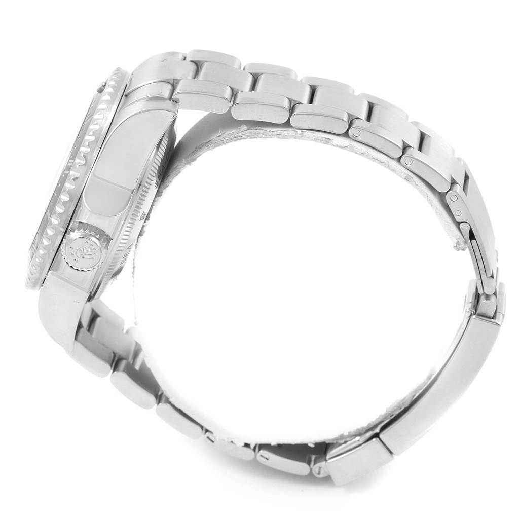 This side view of the Rolex Sea-Dweller 116660 Men
s Stainless Steel Black Dial 116660 Men
s Stainless Steel Black Dial watch shows the crown, bezel edge, and metal bracelet.