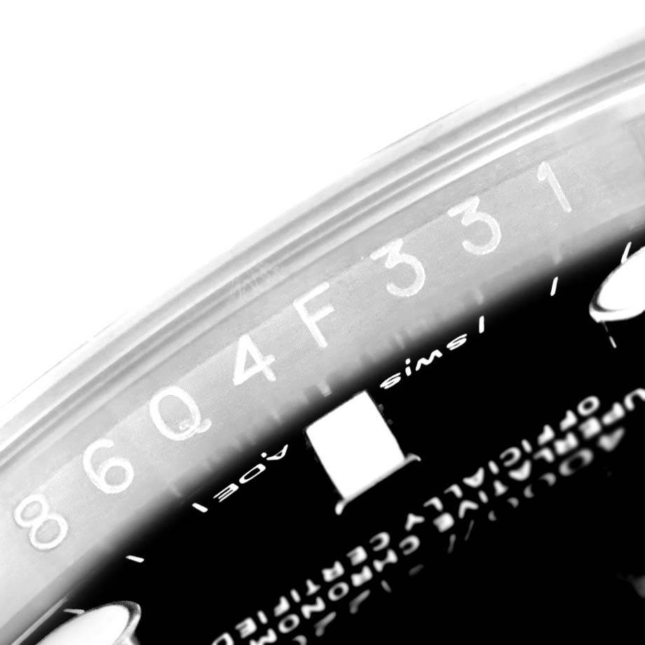 This close-up shows the rehaut engraving and partial dial of a Rolex Sea-Dweller 116600 Men's Stainless Steel Black Dial 116600 Men's Stainless Steel Black Dial watch.