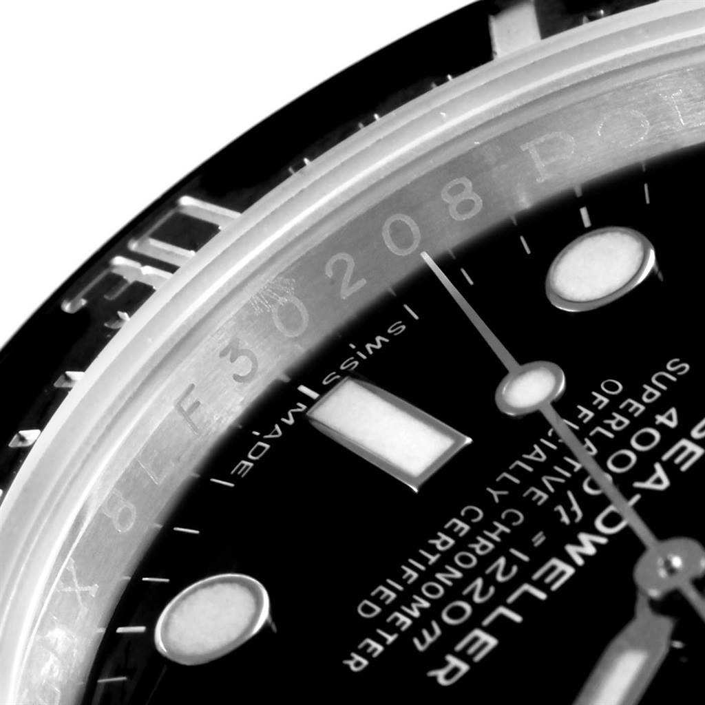The image shows a close-up of the dial, bezel edge, and part of the chapter ring of a Rolex Sea-Dweller 116600 Men's Stainless Steel Black Dial 116600 Men's Stainless Steel Black Dial watch.