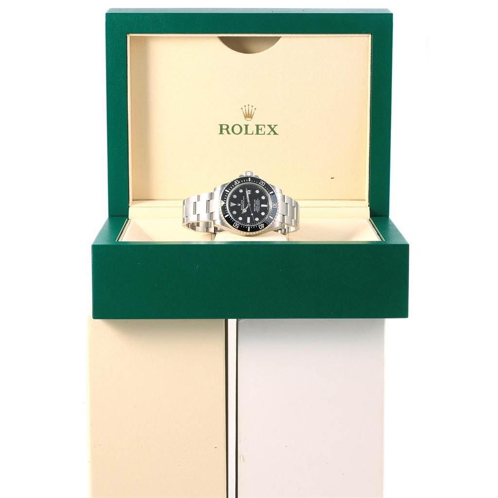 The Rolex Sea-Dweller 116600 Men's Stainless Steel Black Dial 116600 Men's Stainless Steel Black Dial watch is displayed front-on in its open green presentation box.