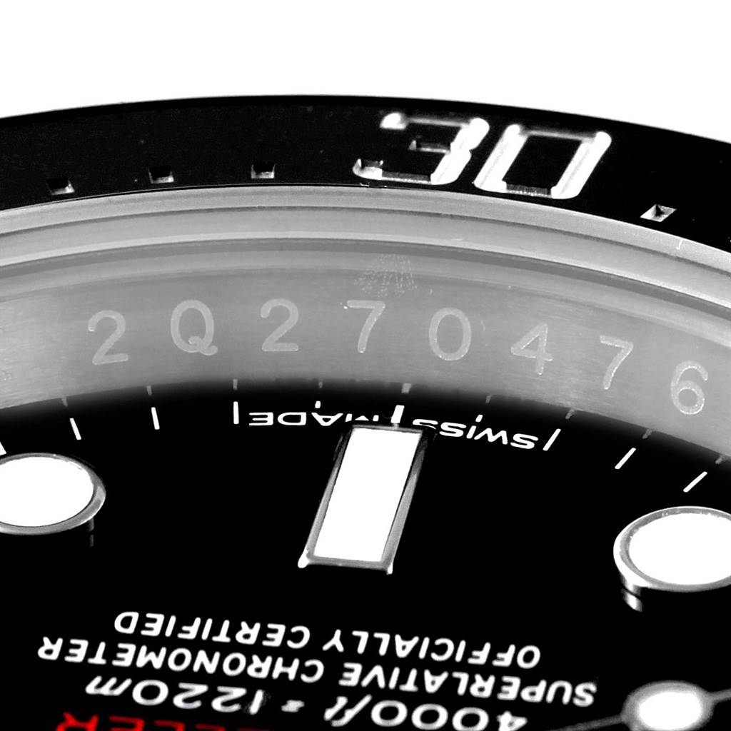 This image provides a close-up view of the bezel, dial, and part of the chapter ring of a Rolex Sea-Dweller 126600 Men's Stainless Steel Black Dial 126600 Men's Stainless Steel Black Dial watch.