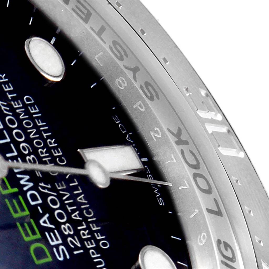 This close-up shot of the Rolex Sea-Dweller 116660 Men's Stainless Steel Blue Dial 116660 Men's Stainless Steel Blue Dial watch highlights the dial, bezel, and part of the text.