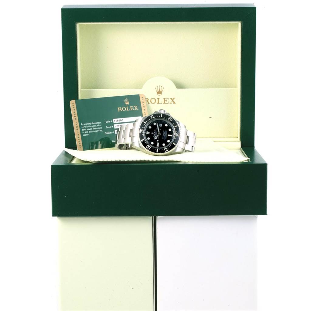 The image features a Rolex Sea-Dweller 116660 Men's Stainless Steel Black Dial 116660 Men's Stainless Steel Black Dial watch placed in its open box with accompanying documentation visible behind it.