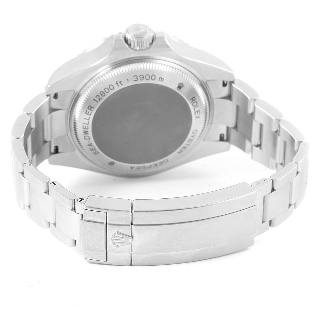 The image shows the backside of a Rolex Sea-Dweller 116660 Men's Stainless Steel Black Dial 116660 Men's Stainless Steel Black Dial watch, highlighting its case back, crown, and bracelet with a clasp.