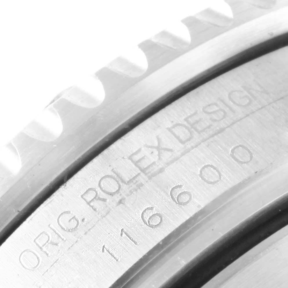 The image shows a close-up of the bezel and inner rim of the Rolex Sea-Dweller 116600 Men
s Stainless Steel Black Dial 116600 Men
s Stainless Steel Black Dial watch, featuring the engraving "ORIG. ROLEX DESIGN 116600."