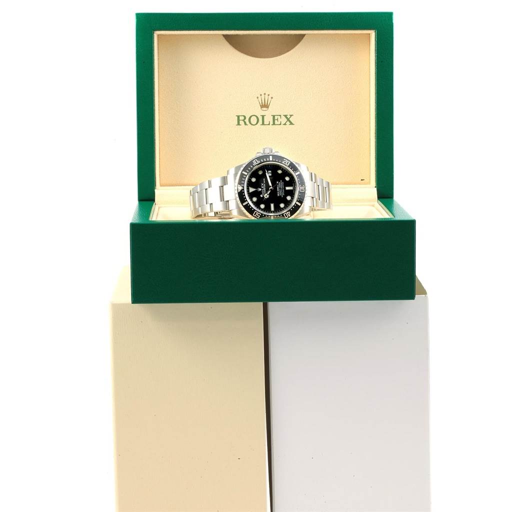 The Rolex Sea-Dweller 116600 Men
s Stainless Steel Black Dial 116600 Men
s Stainless Steel Black Dial watch is displayed front-facing, nestled in an open green box with the brand logo visible.