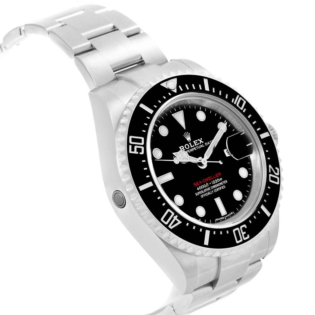 The image shows a side angle view of the Rolex Sea-Dweller 126600 Men
s Stainless Steel Black Dial 126600 Men
s Stainless Steel Black Dial watch, displaying its bezel, dial, and part of the bracelet.