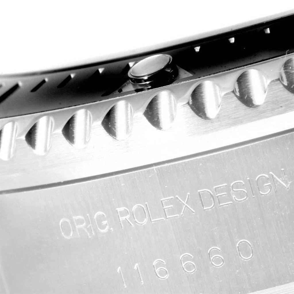 The image shows a close-up angle of the bezel and case back of the Rolex Sea-Dweller 116660 Men
s Stainless Steel Black Dial 116660 Men
s Stainless Steel Black Dial watch, featuring its model number and design engraving.