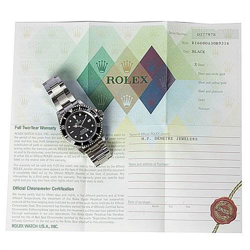 The image shows a Rolex Sea-Dweller 16600 Men's Stainless Steel Black Dial 16600 Men's Stainless Steel Black Dial watch placed on top of its warranty and certification papers.