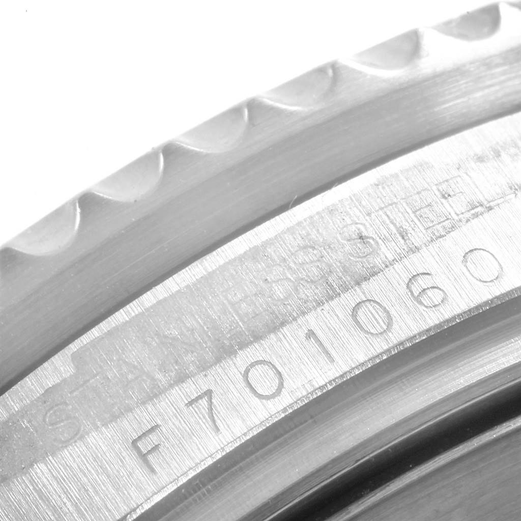 This image shows a close-up of the serrated edge and serial number engraving on a Rolex Sea-Dweller 16600 Men
s Stainless Steel Black Dial 16600 Men
s Stainless Steel Black Dial.
