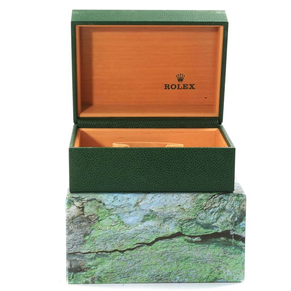 The image shows an open green and wooden Rolex watch box for the Sea-Dweller model with the Rolex logo inside the lid.