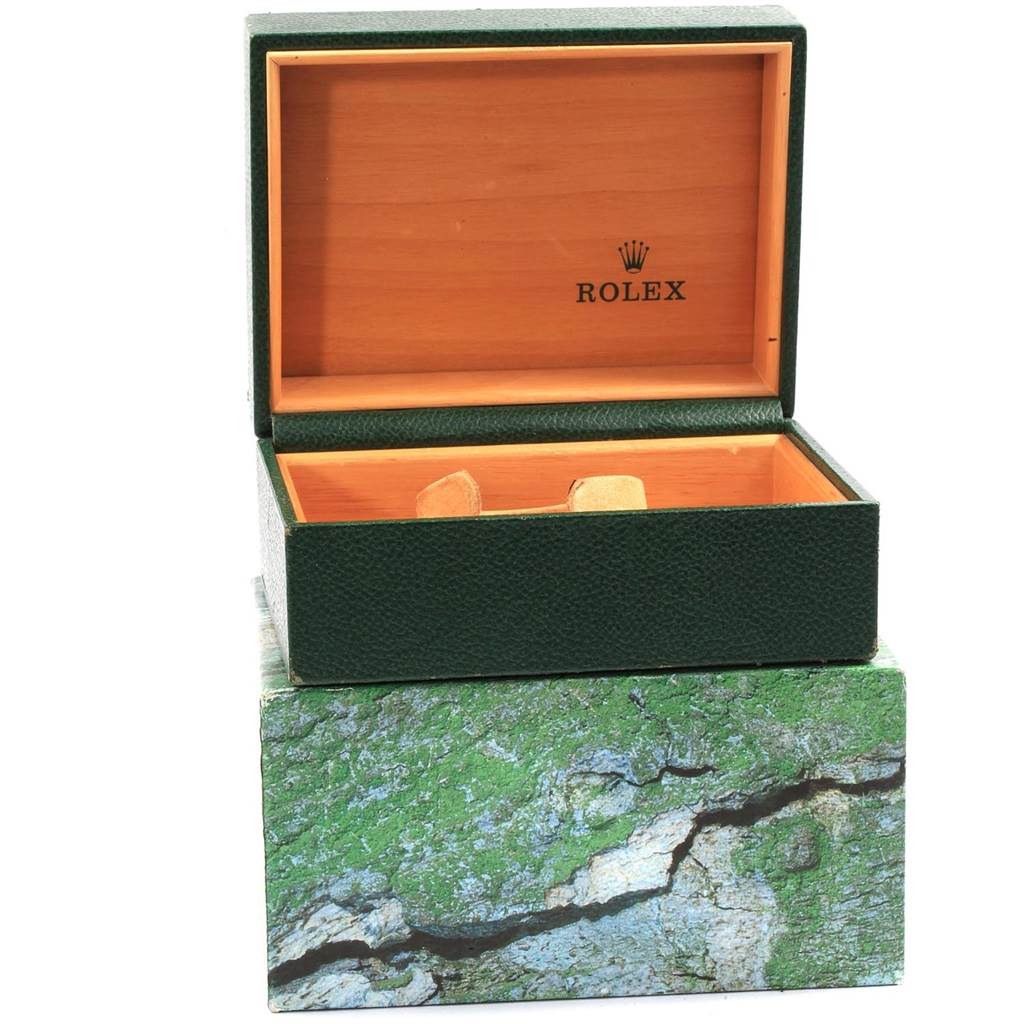 The image shows a green Rolex Sea-Dweller 16600 Men
s Stainless Steel Black Dial 16600 Men
s Stainless Steel Black Dial watch box, with the inner wooden box open and revealing the inner compartments.