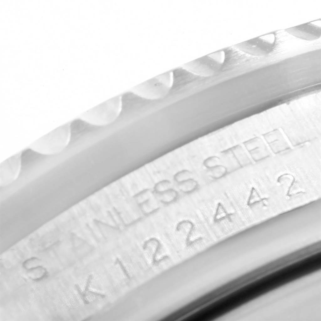 The image shows a close-up of the stainless steel bezel and casing of a Rolex Sea-Dweller 16600 Men
s Stainless Steel Black Dial 16600 Men
s Stainless Steel Black Dial watch.