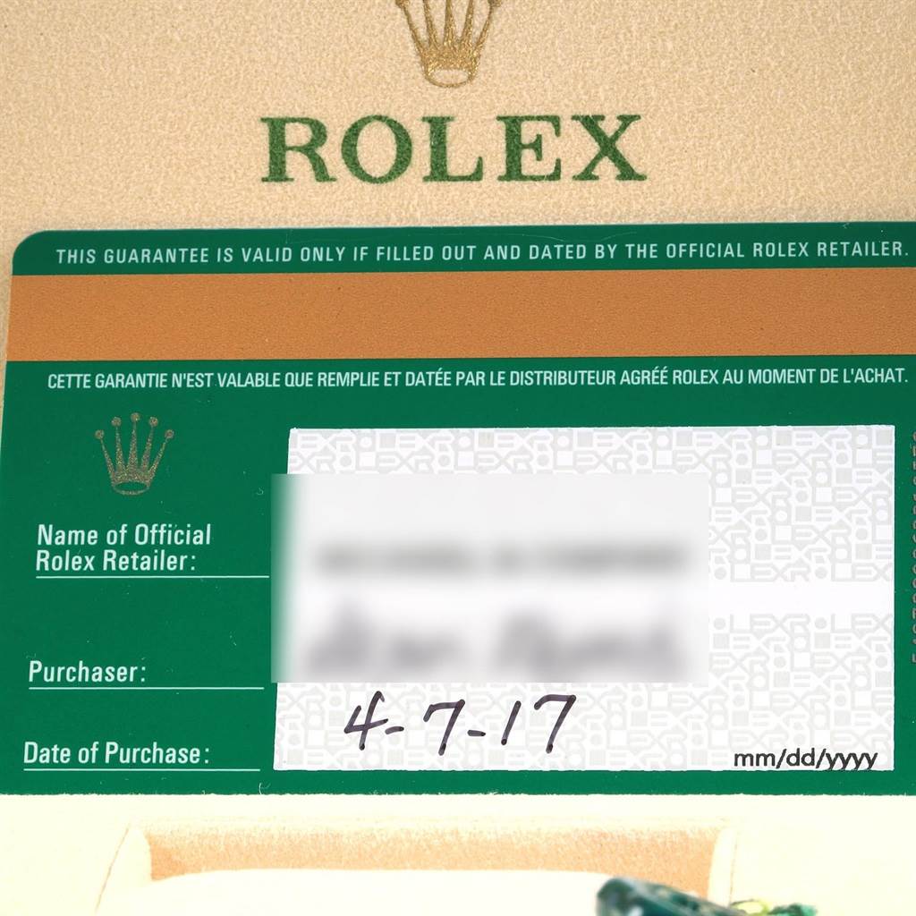 This image shows a close-up of the warranty card for a Rolex Sea-Dweller 116660 Men's Stainless Steel Blue Dial 116660 Men's Stainless Steel Blue Dial watch, displaying the brand's logo and purchase date.