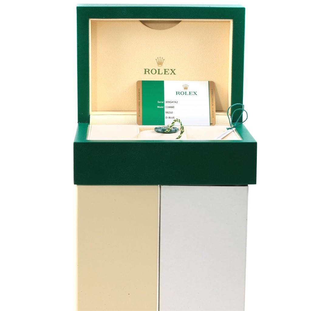 The image shows a Rolex Sea-Dweller 116660 Men's Stainless Steel Blue Dial 116660 Men's Stainless Steel Blue Dial watch box, including the brand's warranty card and a green hang tag.
