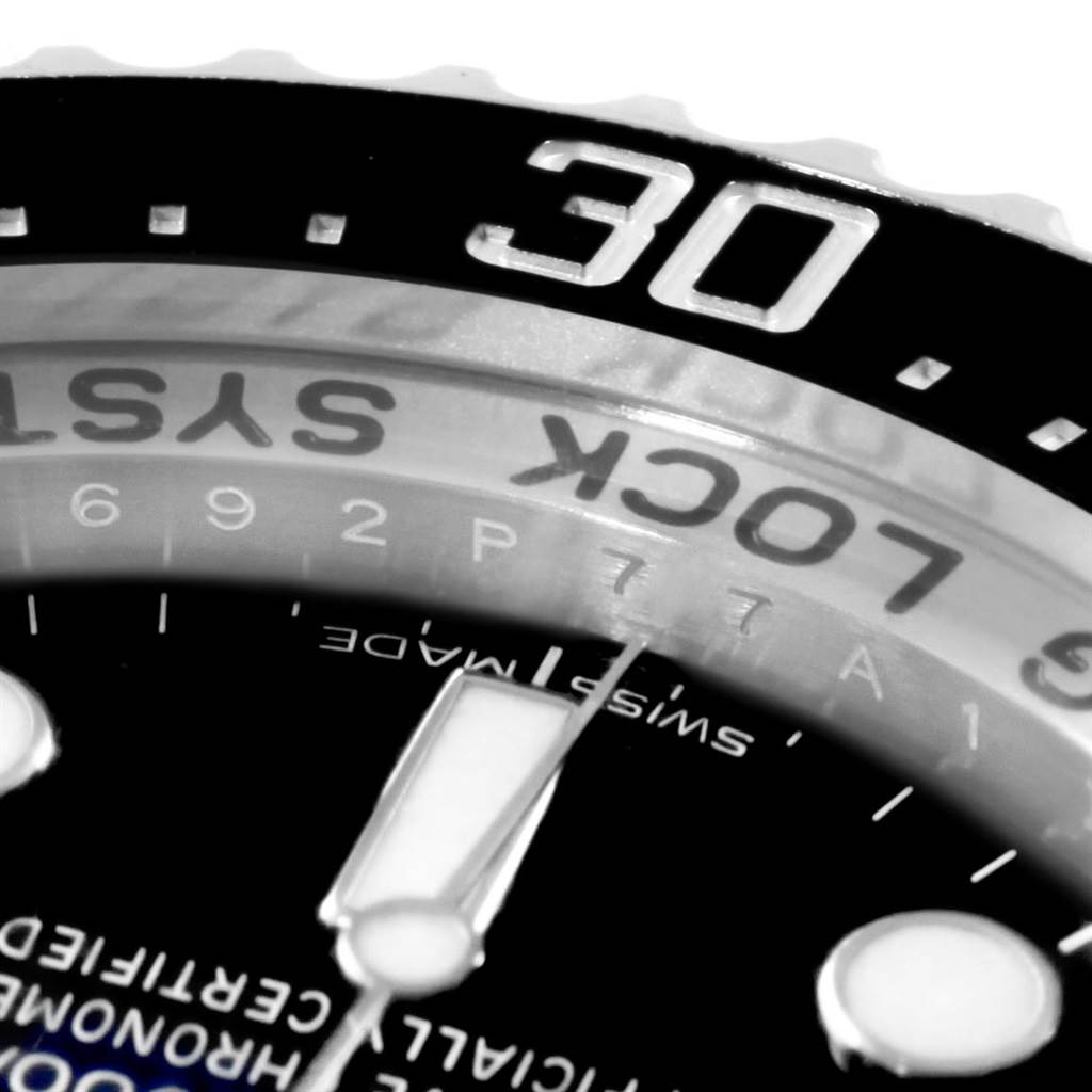 This zoomed-in shot of the Rolex Sea-Dweller 116660 Men's Stainless Steel Blue Dial 116660 Men's Stainless Steel Blue Dial shows the bezel with the number 30 and part of the dial with the hour marker and hand.