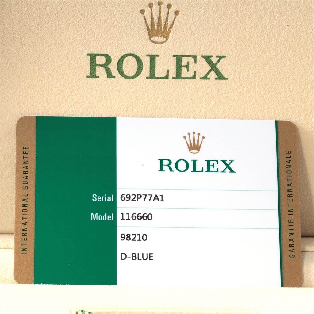 This Rolex Sea-Dweller 116660 Men's Stainless Steel Blue Dial 116660 Men's Stainless Steel Blue Dial model shows its international guarantee card with serial number, model number, bracelet reference, and dial color.