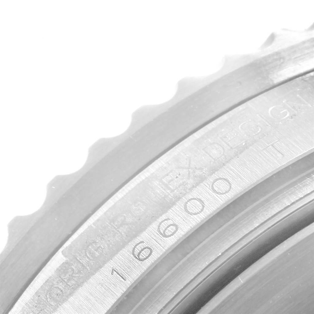 The image shows a close-up of the edge of the bezel and engraved reference number on the watch case of a Rolex Sea-Dweller 16600 Men
s Stainless Steel Black Dial 16600 Men
s Stainless Steel Black Dial model.