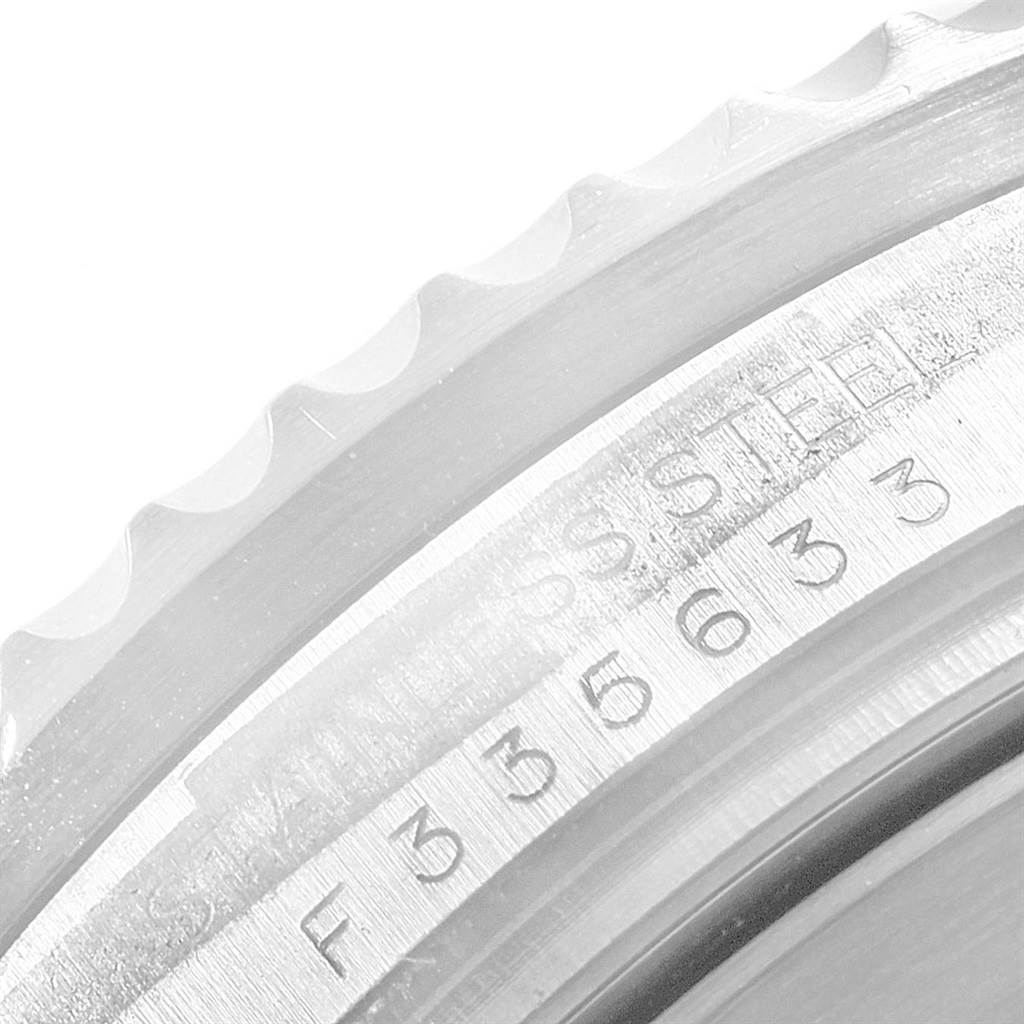 This image shows a close-up of the bezel edge and engraved serial number of a Rolex Sea-Dweller 16600 Men
s Stainless Steel Black Dial 16600 Men
s Stainless Steel Black Dial watch.