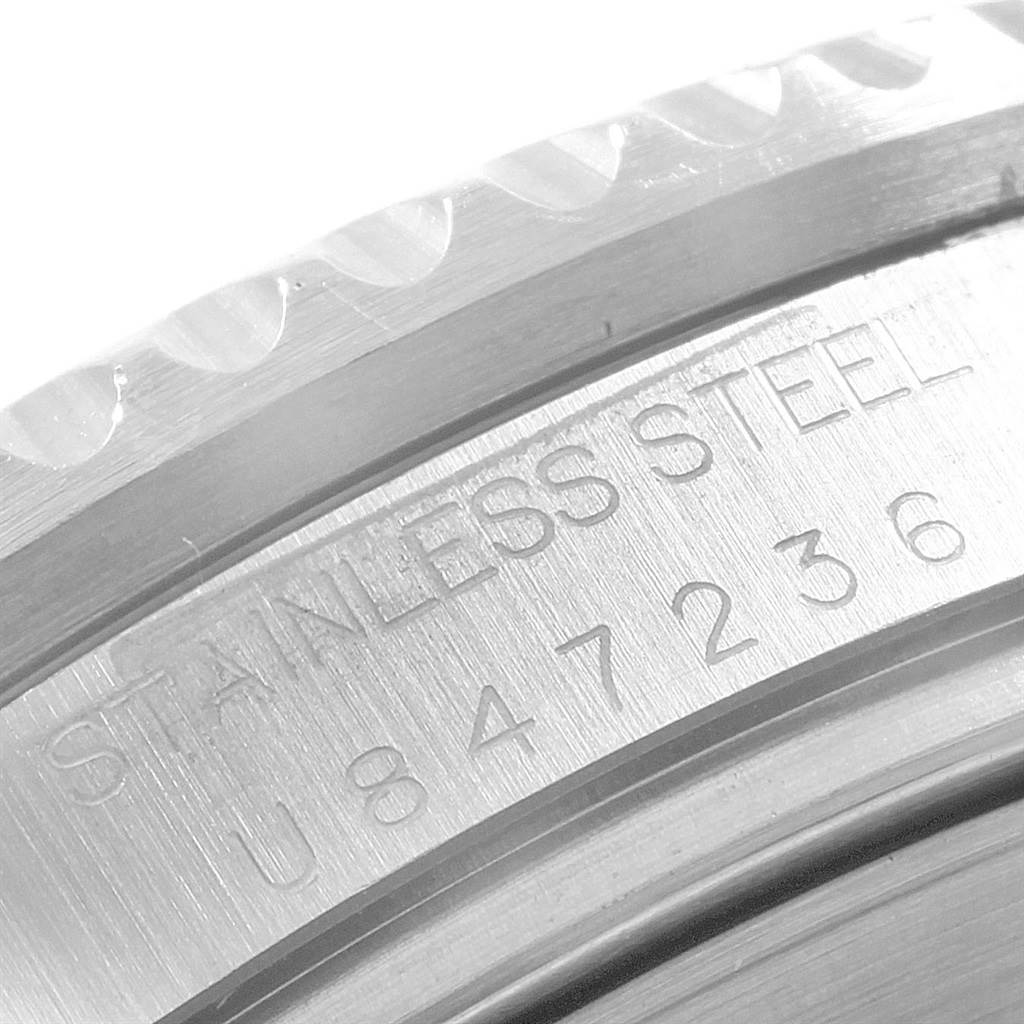 This image shows a close-up of the serial number and "STAINLESS STEEL" engraving on the bezel of the Rolex Sea-Dweller 16600 Men
s Stainless Steel Black Dial 16600 Men
s Stainless Steel Black Dial watch.