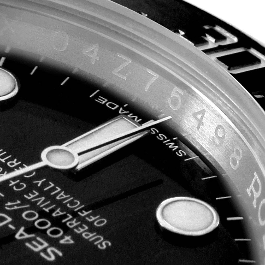 This close-up image shows the dial, hour markers, and partial bezel of the Rolex Sea-Dweller 116600 Men
s Stainless Steel Black Dial 116600 Men
s Stainless Steel Black Dial watch.