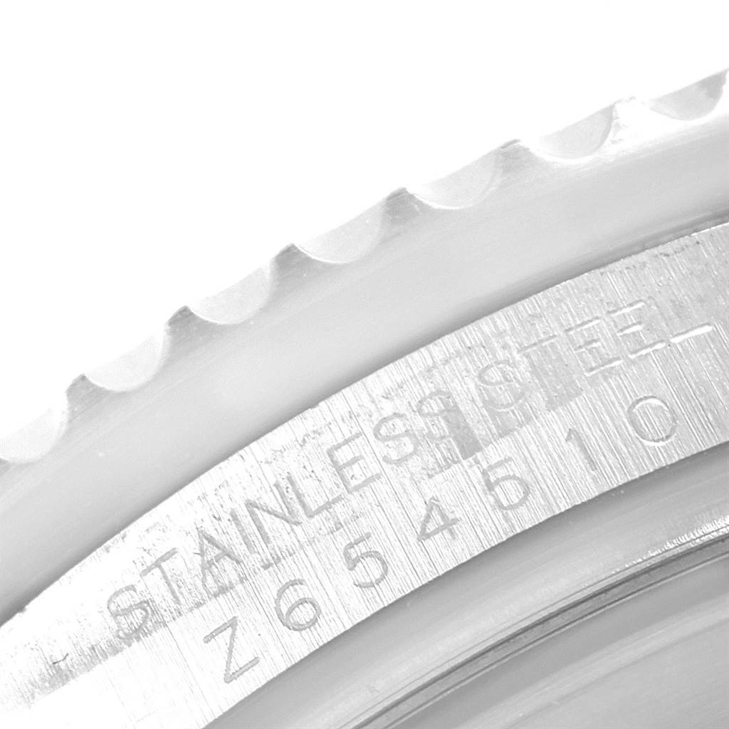 The image shows a close-up of the bezel and engraved case edge of a Rolex Sea-Dweller 16600 Men
s Stainless Steel Black Dial 16600 Men
s Stainless Steel Black Dial watch, highlighting the stainless steel material.