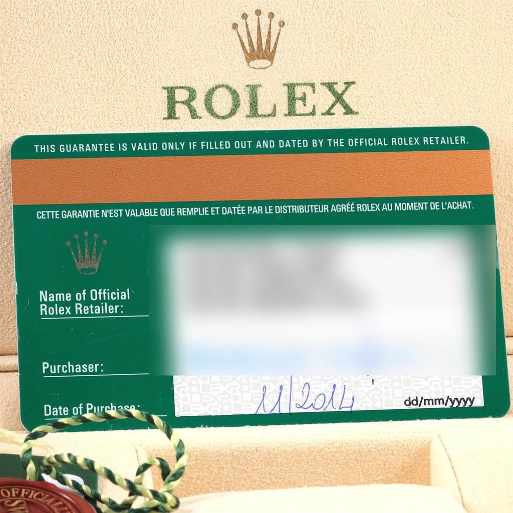 The image shows a Rolex guarantee card and some packaging for the Sea-Dweller model.