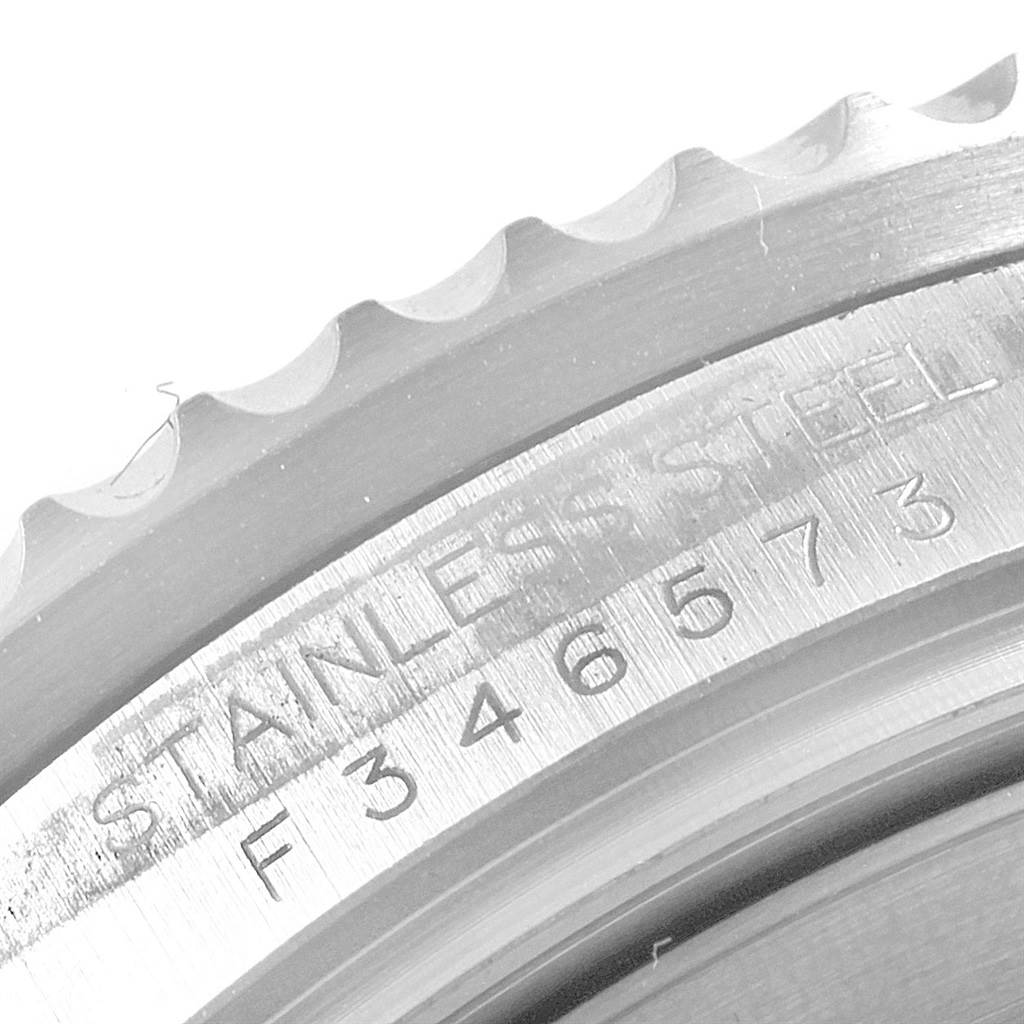 The image shows a close-up of the textured bezel and engraved case back of the Stainless Steel Rolex Sea-Dweller 16600 Men
s Stainless Steel Black Dial 16600 Men
s Stainless Steel Black Dial watch, model F346573.