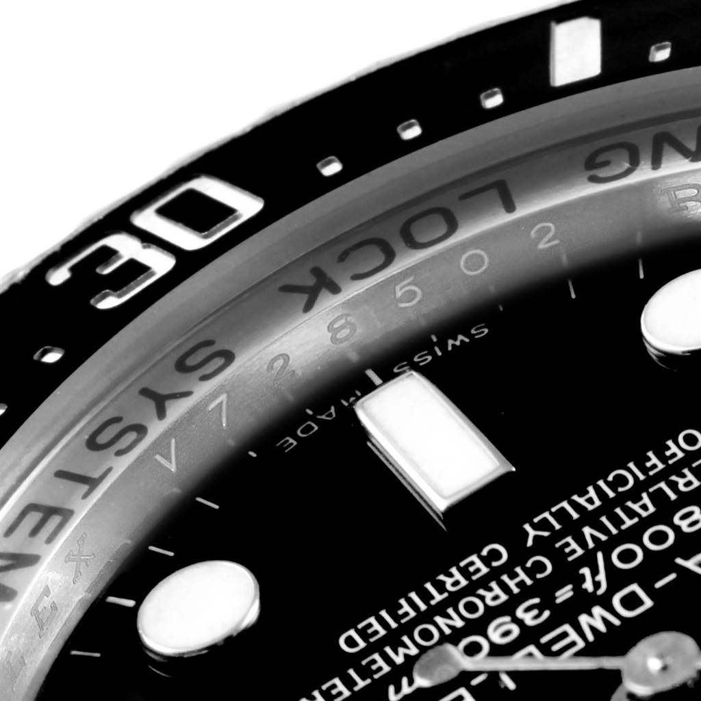 The image shows a close-up of the bezel, dial, markers, and some text on a Rolex Sea-Dweller 116660 Men
s Stainless Steel Black Dial 116660 Men
s Stainless Steel Black Dial watch.
