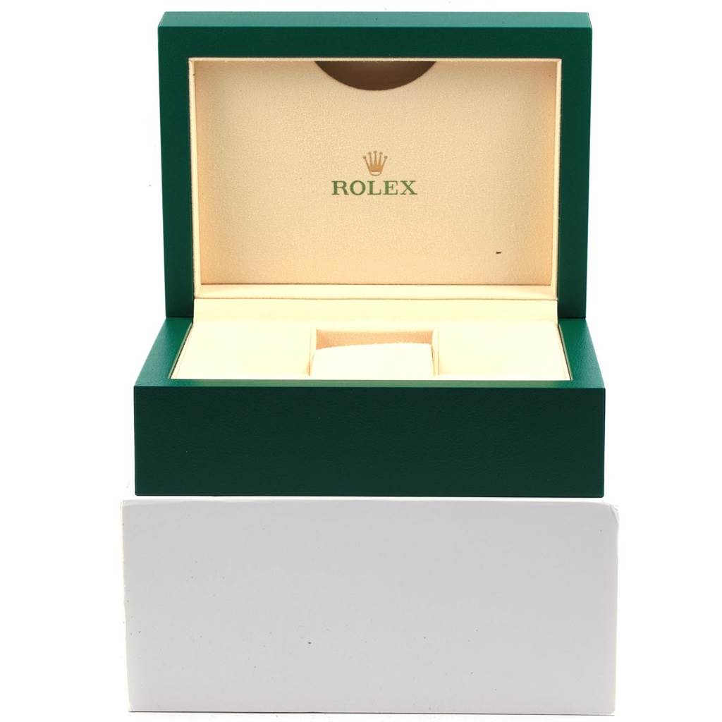 This image shows the open green and beige box for the Rolex Sea-Dweller 116600 Men
s Stainless Steel Black Dial 116600 Men
s Stainless Steel Black Dial watch, without the watch inside.